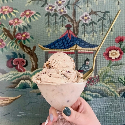 Photograph of Wild Irish Oats ice cream in front of ornate wallpaper